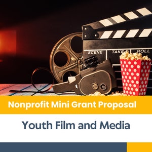 May include: A black and white clapperboard with the words "SCENE", "TAKE", and "ROLL" on it. A vintage film camera, a film reel, and a red and white polka dot popcorn bucket are on a wooden table in front of the clapperboard. The background is dark with a red spotlight.