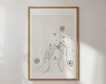 May include: A black and white line art print of two hands reaching up towards a scattering of small flowers. The print has a minimalist aesthetic and would look great in a modern home.