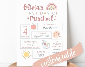 May include: A printable first day of preschool sign with a rainbow arch, a sun, an apple, a paint palette, and a notebook. The sign is customizable with text boxes for the child's name, age, teacher's name, and favorite things.
