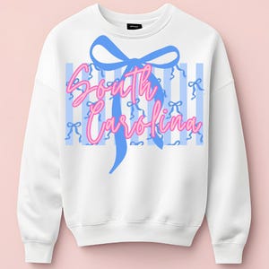 May include: A handmade wooden sign with the text "Welcome" in a playful font. The sign features a distressed white background and a dark brown frame, perfect for a front door or entryway. The sign measures approximately 12 inches wide and 6 inches tall.