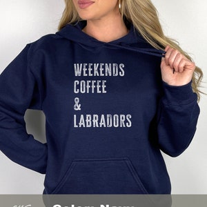May include: Navy blue hooded sweatshirt with the text "Weekends Coffee & Labradors" printed in white on the front. The sweatshirt is a Gildan 18500 Heavy Blend Hooded Sweatshirt.