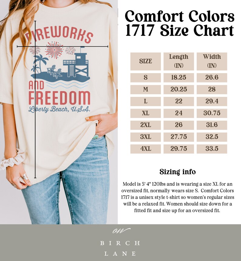 May include: Cream-colored t-shirt with a graphic design featuring fireworks, palm trees, a lifeguard tower, and the text "Fireworks and Freedom, Liberty Beach, U.S.A." A size chart is also visible.