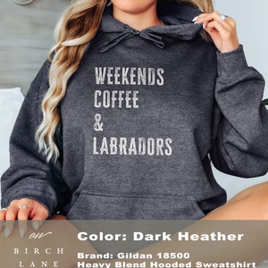 May include: Dark heather grey hooded sweatshirt with the text "Weekends Coffee & Labradors" printed in white.