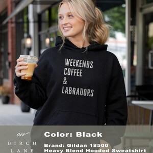 May include: Black hooded sweatshirt with the text "Weekends Coffee & Labradors" printed on the front. The sweatshirt is a Gildan 18500 Heavy Blend Hooded Sweatshirt.