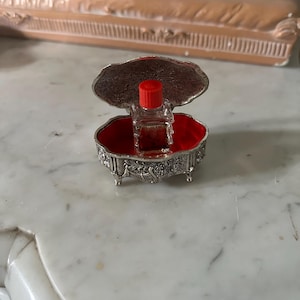 French Vintage PAT JAPAN silver trinket oval shaped box on legs, cherubs, vines, floral, and mini bottle of perfume Neija Moulin Rouge Paris