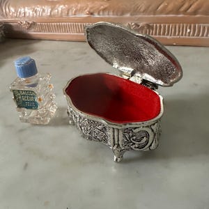 French Vintage PAT JAPAN silver trinket oval shaped box on legs floral, cherubs, harps, mini bottle of perfume Balcon Fleuri Paris Neija