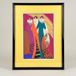 May include: A framed art print featuring three figures in long, flowing gowns. The artwork uses a vibrant color palette of purple, orange, and teal against a pink and yellow background. The print is set within a black frame and a yellow mat.
