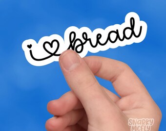 May include: White sticker with black text that reads "I love bread" with a heart symbol in place of the "o" in love.