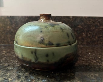 Handcrafted ceramic green speckled copper lidded jar