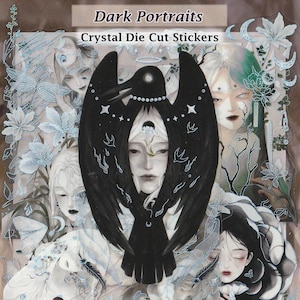 May include: A set of die-cut stickers featuring black and white illustrations of people with a crow and floral designs. The stickers are labeled "Dark Portraits Crystal Die Cut Stickers".