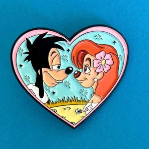 May include: A heart-shaped enamel pin featuring a cartoon couple, Goofy and a red-haired woman, with a pink flower in her hair. They are looking at each other with a romantic expression. The pin has a light blue background with white stars.