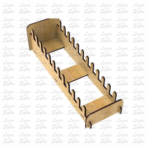 May include: A wooden laser-cut display shelf with multiple slots for holding items. The shelf is rectangular with a light brown finish. The design includes a series of evenly spaced, curved cutouts along the top edges. The text "Laser Cut File" is visible.