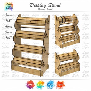 Può includere: Un espositore in legno per braccialetti, con quattro livelli di rulli rotondi. L'espositore è realizzato in legno naturale e ha un design semplice e moderno. L'espositore è perfetto per esporre braccialetti di diverse dimensioni e stili.