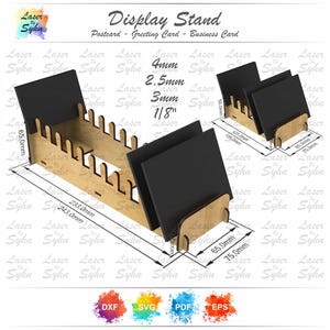 May include: A laser-cut wooden display stand for postcards, greeting cards, or business cards. The stand has a natural wood finish and black card inserts. Dimensions are in mm and inches.