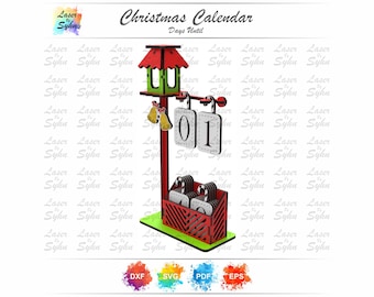 May include: A wooden Christmas calendar with a red and green birdhouse design at the top. The calendar displays "01" on a hanging sign, with a red and green base. The text "Christmas Calendar Days Until" is above the calendar.