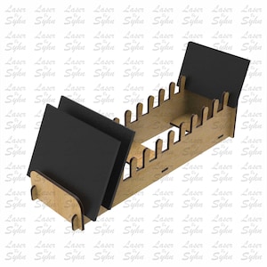 May include: A laser-cut wooden organizer with black dividers. The organizer has a rectangular base with slots and two black panels. The text "Laser Cut File" is visible on the right side of the image.