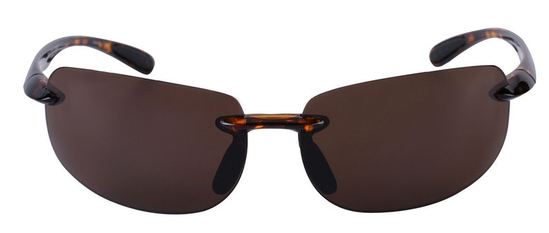 May include: Tortoise shell frame sunglasses with brown lenses. The sunglasses have a rimless design and a classic shape.