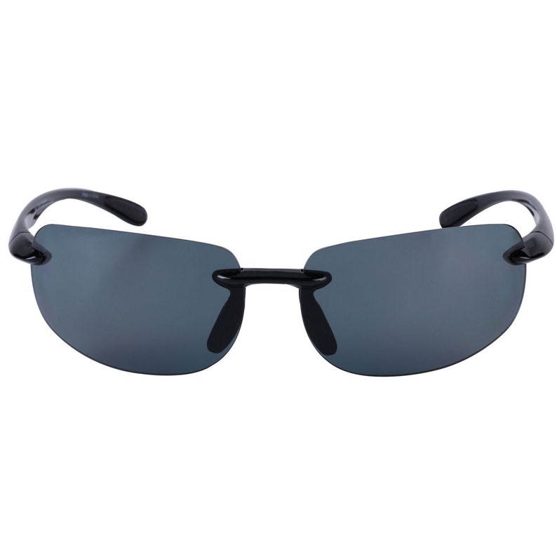 May include: Black sunglasses with a rimless design and dark gray lenses.