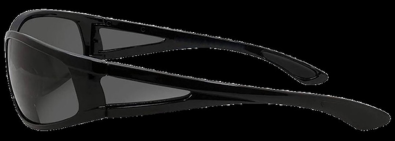 May include: Black wraparound sunglasses with a sleek, modern design. The sunglasses have a dark gray lens and a black frame.