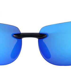 May include: Black sunglasses with blue mirrored lenses. The sunglasses have a rimless design and a curved shape.