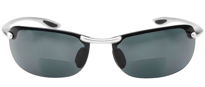 May include: A pair of black sunglasses with a silver frame. The sunglasses have a rimless design and dark gray lenses.