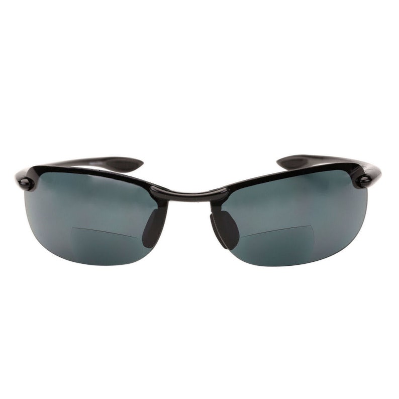May include: Black wraparound sunglasses with dark gray lenses.