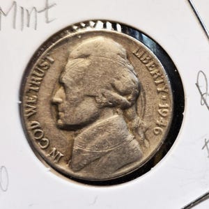 May include: A set of three ceramic mugs with a speckled, matte finish. The mugs are in shades of cream, light gray, and dark gray. Each mug has a simple, minimalist design, perfect for coffee or tea.