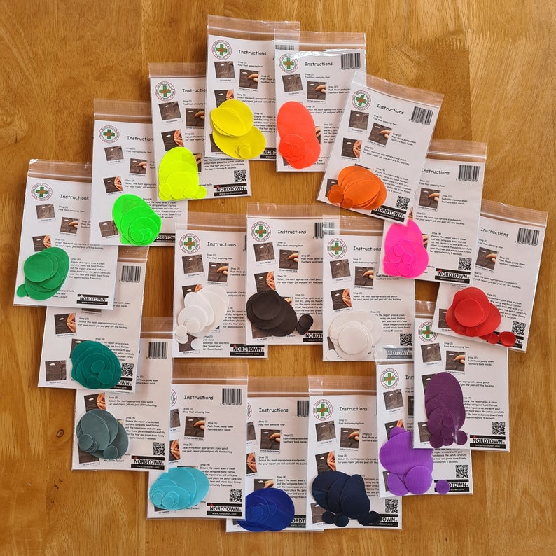 May include: Assortment of colourful felt circles packaged with instructions. The circles are in various colours, including red, orange, yellow, green, blue, purple, and black. The instructions are printed on white paper with a green logo.