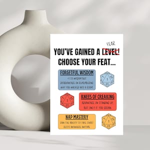 May include: A humorous card with a cartoon style design. It features a red, white, and blue graphic of a dice with the text "You've gained a level! Choose your feat..."  The card has three options: "Forgetful Wisdom", "Knees of Creaking", and "Nap Mastery".