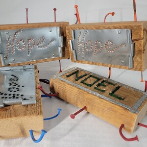 Steel Plated hope and sleds signs