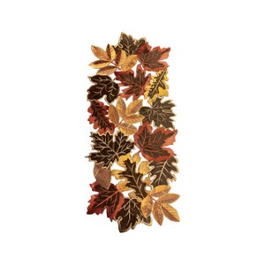 May include: A decorative leaf-shaped table runner. The runner features a variety of autumn leaves in shades of brown, gold, and orange. The leaves are arranged in a vertical pattern, creating a fall-themed accent for a dining table.