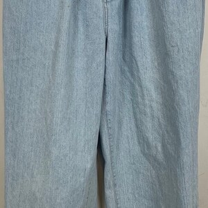 May include: Light blue denim pants with a button fly and two front pockets. The pants have a relaxed fit and are made of a soft, comfortable fabric.