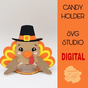 May include: A digital SVG file for a Thanksgiving turkey candy holder. The turkey is brown with a red wattle and yellow and orange feathers. It is wearing a black hat with a brown band. The text "CANDY HOLDER" and "SVG STUDIO" is in red and the text "DIGITAL" is in white.
