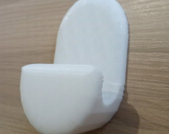 Gardinstångshållare