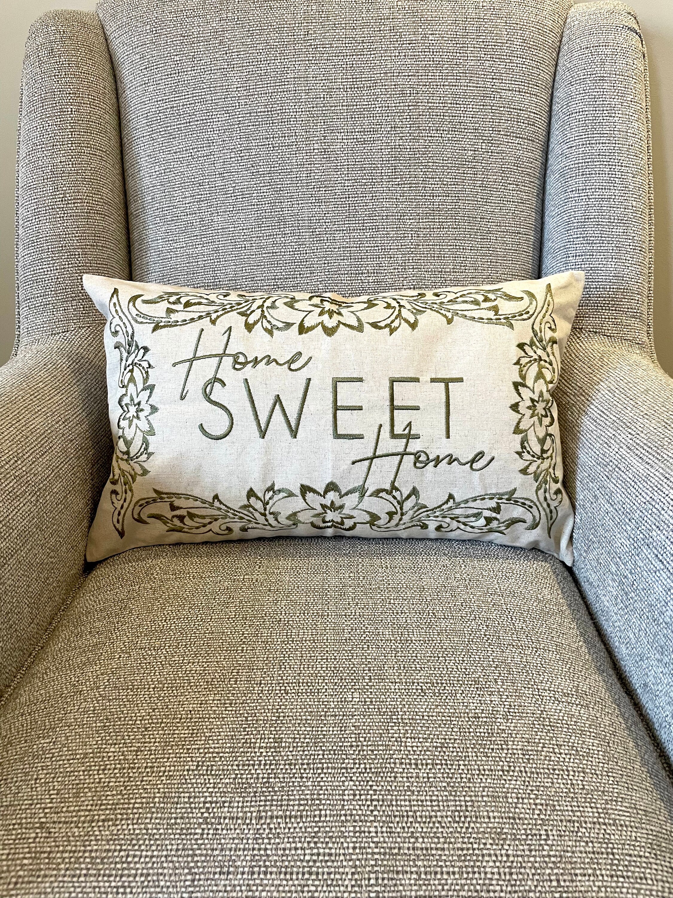Grey slogan cushion 2025