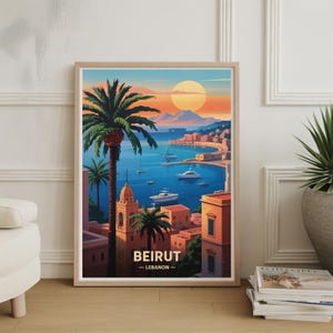 May include: A framed art print showing a coastal view of Beirut, Lebanon. The image features a sunset over the sea, with palm trees, buildings, and boats. The text "BEIRUT - LEBANON" is displayed at the bottom of the print.