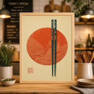 May include: Framed artwork featuring a red circle with a wave pattern, resembling the Japanese flag. Two teal chopsticks with gold floral accents are centered. The artwork includes Japanese text in a small square.