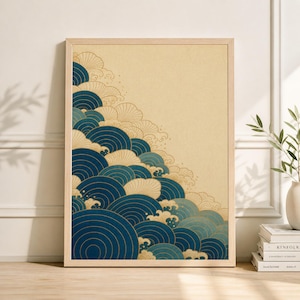 May include: A framed art print featuring a stylized depiction of ocean waves. The artwork showcases a gradient of blue hues with gold accents against a beige background. The waves are arranged in a cascading pattern, creating a sense of movement.