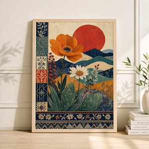 May include: A framed art print with a floral and landscape design. The artwork depicts an orange poppy and a white daisy set against rolling hills, a red sun, and a patterned border with floral and geometric motifs.