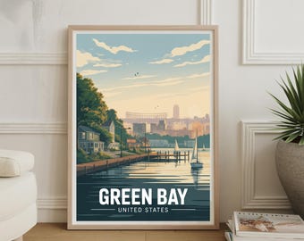 May include: Framed art print featuring a stylized illustration of Green Bay, Wisconsin. The artwork depicts a waterfront scene with sailboats, buildings, and the text "GREEN BAY UNITED STATES" in white against a dark teal background. The print is in a light wood frame.