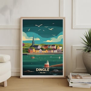 May include: A framed art print featuring a colorful illustration of Dingle, Ireland. The artwork depicts a coastal town with buildings in various colors, a church, a lighthouse, and seagulls in the sky. The print is in a wooden frame.