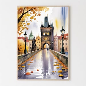 Pode incluir: Pintura em aquarela de uma cena de ponte de cidade europeia. A obra apresenta uma ponte de pedra com uma torre, postes de luz e folhas de outono. A paleta de cores inclui tons de amarelo, laranja e azul, criando uma atmosfera acolhedora.