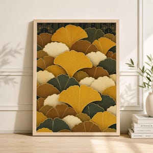 May include: A framed art print featuring a repeating pattern of stylized ginkgo leaves in shades of gold, brown, cream, and dark green. The artwork has a black background with gold accents and is displayed in a light wood frame.