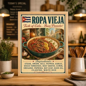 May include: A framed print featuring a Cuban Ropa Vieja dish. The image includes the text "ROPA VIEJA Taste of Cuba... Buen Provecho!" and a list of ingredients. The dish is served with white rice and garnished with lemon slices.