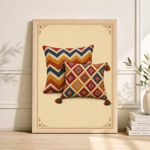 May include: Two decorative cushions with vibrant geometric patterns. One cushion has a chevron design in red, orange, yellow, and blue. The other has a diamond pattern in red, yellow, and blue, with tassels.