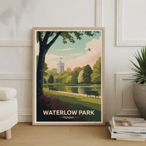 May include: A framed art print featuring a park scene with a lake, trees, and benches. The artwork has a vintage style with a color palette of greens, blues, and browns. The text "WATERLOW PARK - Highgate" is at the bottom of the print.
