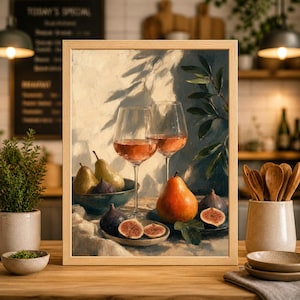 May include: A framed still life painting featuring two wine glasses filled with rose wine, pears, figs, and a bowl of fruit. The painting has a warm color palette with natural light and shadows, creating a cozy atmosphere. The artwork is displayed on a wooden table.