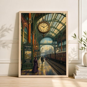 May include: A framed vintage print of a train station interior. The artwork features a large clock, train tracks, and figures walking on the platform. The color palette includes warm tones of brown, gold, and green, creating a nostalgic atmosphere.