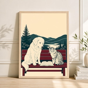 May include: A framed art print depicting a dog and a cat sharing a park bench, with a book between them. The dog is cream-coloured, and the cat is striped. The background shows a forest, mountains, and a lake, all in a vintage style.