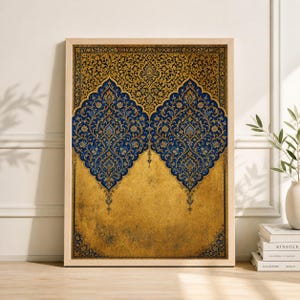 May include: Framed art print featuring an ornate design with gold, blue, and black colors. The artwork has a symmetrical pattern with floral and arabesque motifs. The print is in a wooden frame, suitable for home decor.